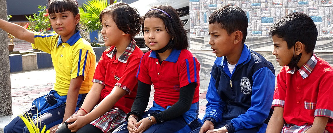 Students sitting outside